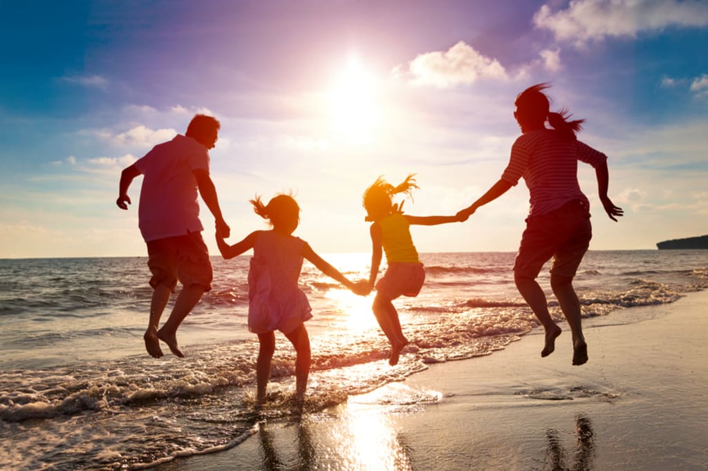 Happy family on Zanzibar beach and safari